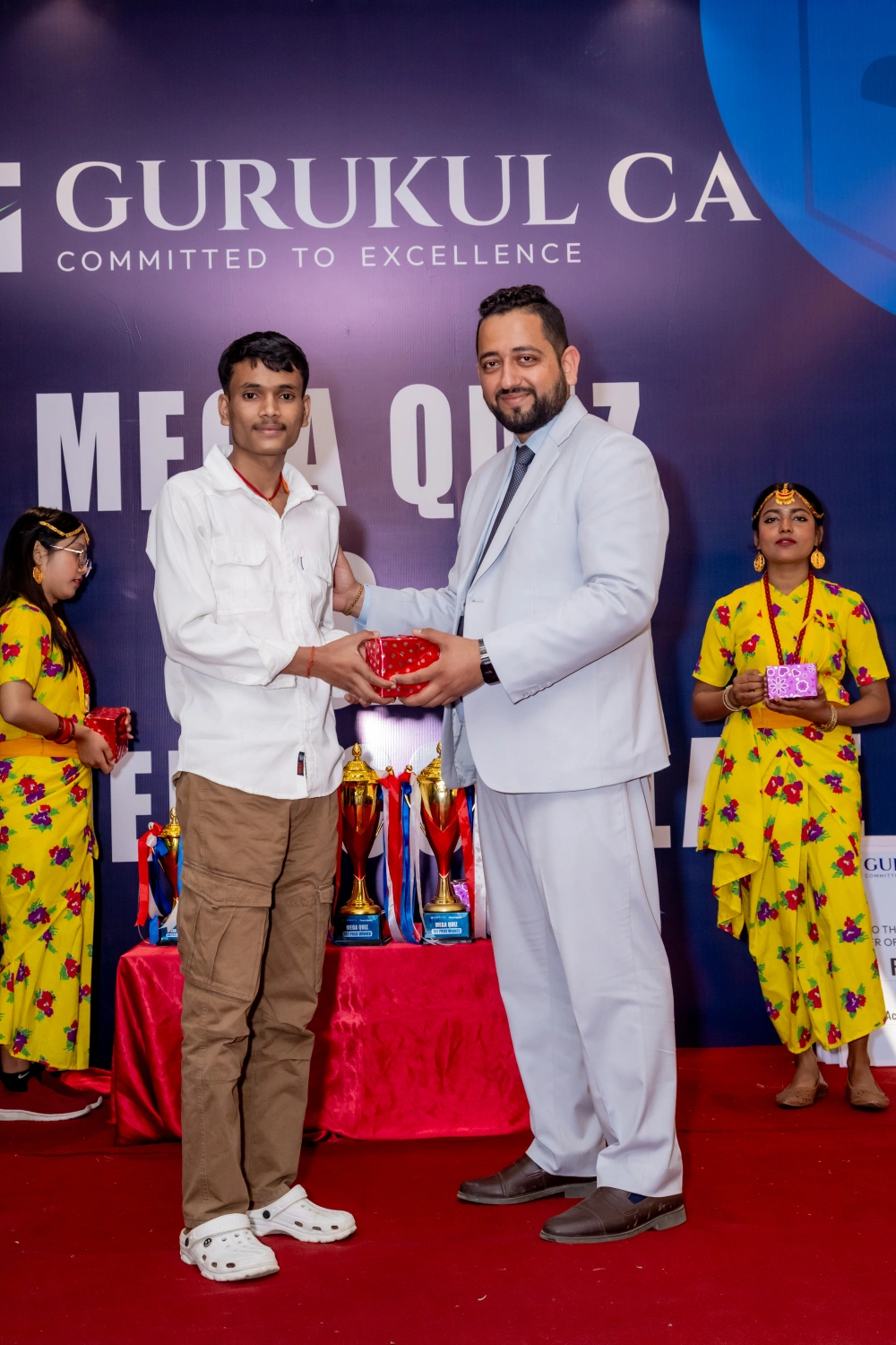 Students receiving certificates and prize cheque