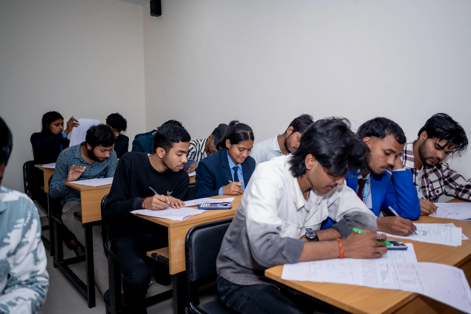 Students writing exams in a classroom