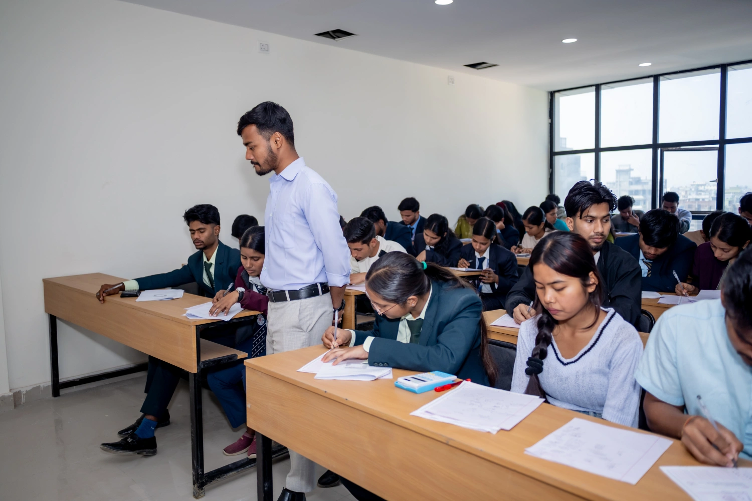Students writing an examination in a classroom
