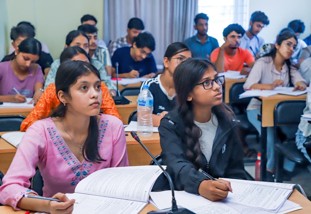 Students attending a classroom learning session and taking notes