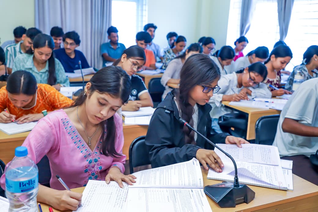 Students studying and taking notes during a classroom session