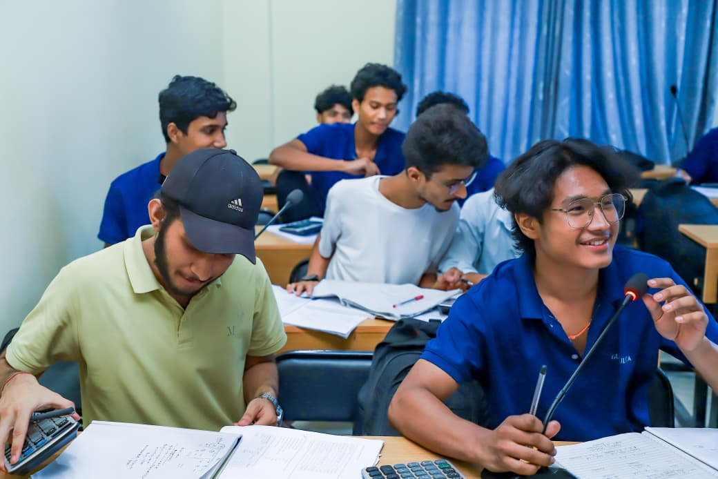 Students studying and taking notes together in a classroom